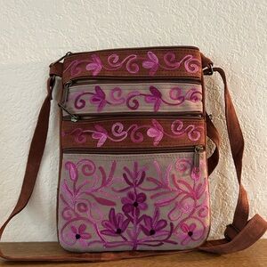 Ray Z Intl crossbody suede embroidered with 5 zippers. Adjustable suede strap.